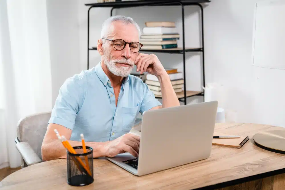serious,older,mature,middle,aged,man,wearing,eyeglasses,looking,at