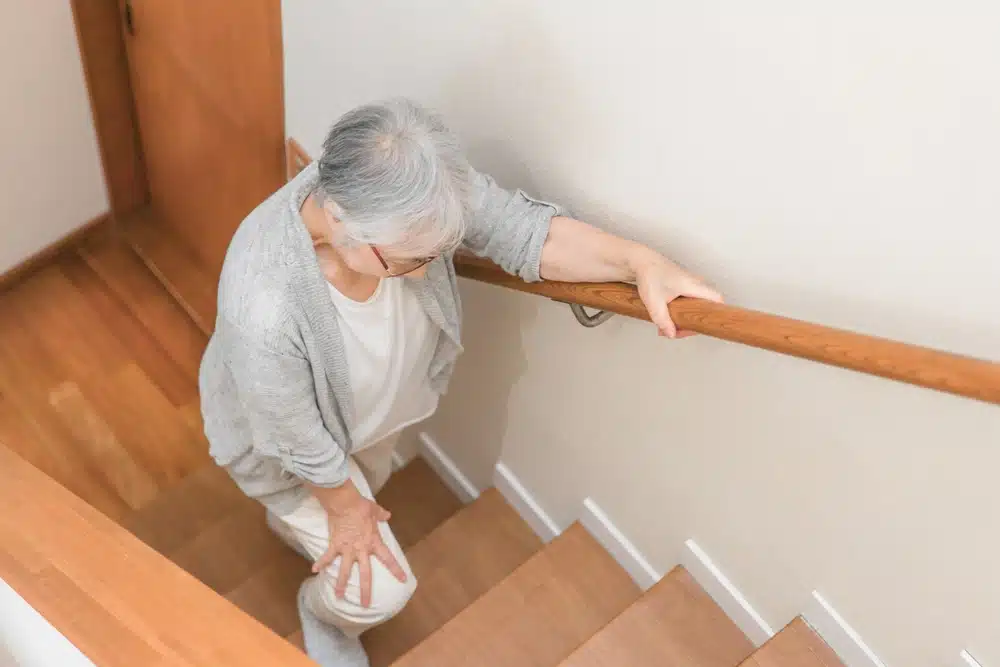 elderly,woman,climbing,the,stairs