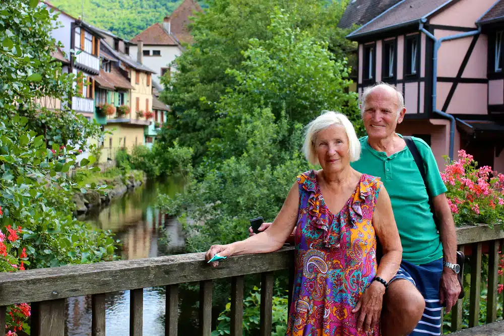 active,senior,couple,traveling,in,france.,elderly,people,visiting,alsace