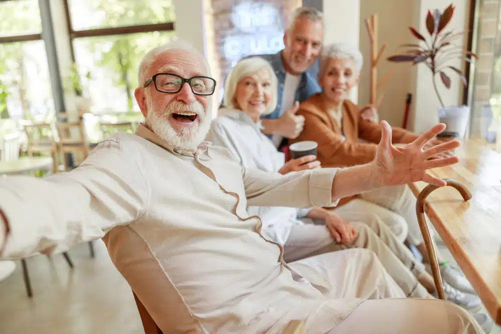 joyful,senior,man,spending,time,with,friends,stock,photo