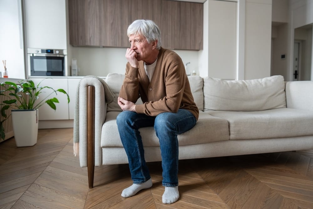 retiree,with,alzheimer,symptoms,covering,mouth,in,painful,gesture,on