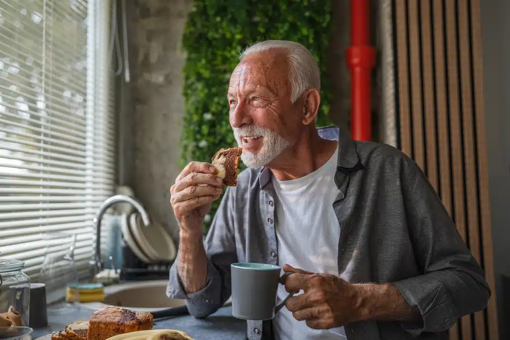 cheerful,retired,man,enjoys,a,peaceful,morning,,savoring,a,slice