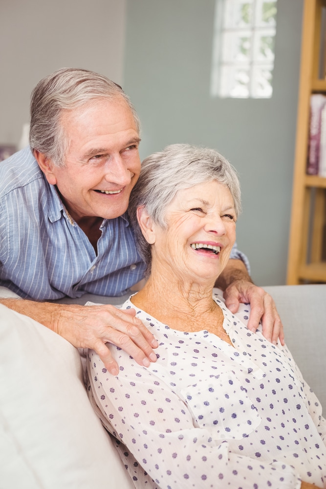 romantic,senior,man,with,his,wife,at,home