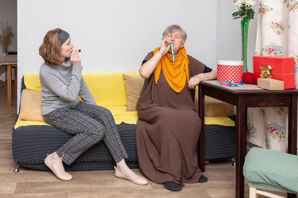 two,women,celebrate,a,special,event.,elderly,woman,and,a