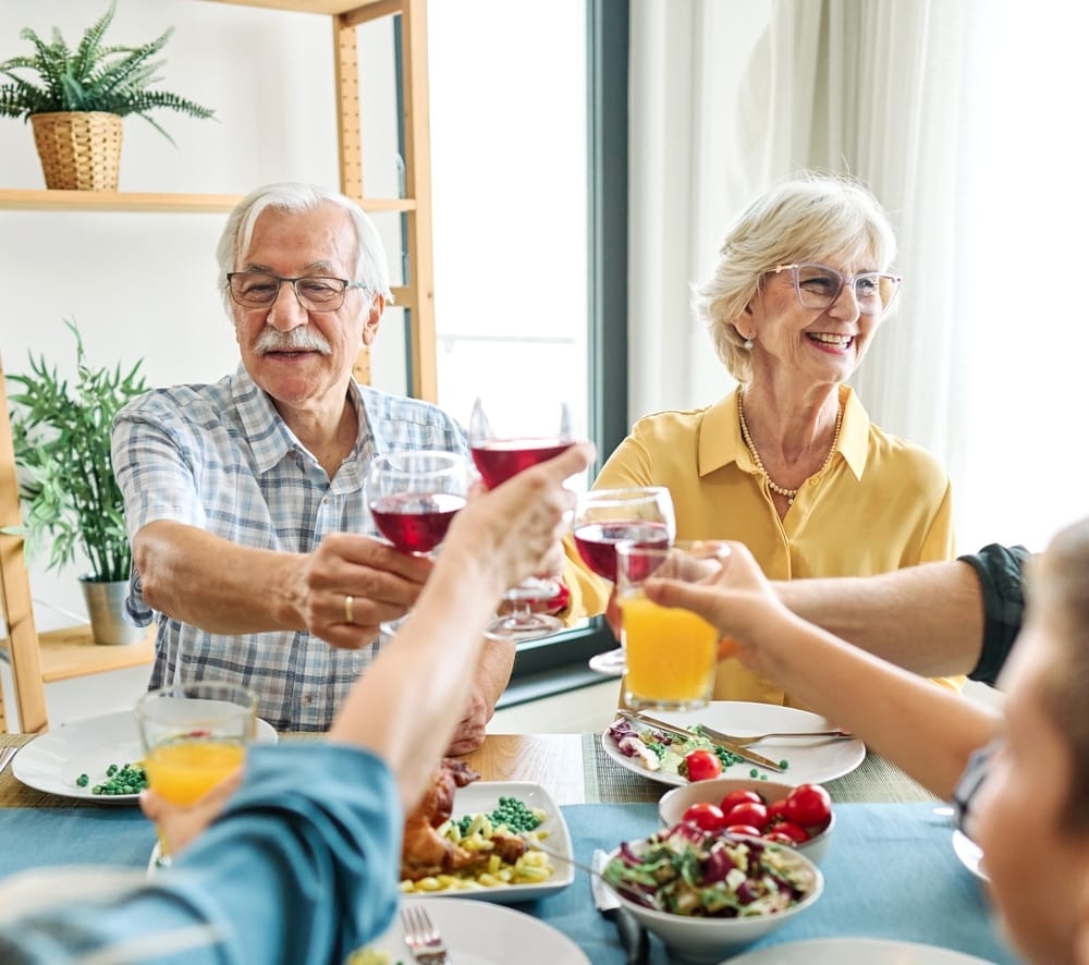 happy,multi generation,family,gathering,around,dining,table,and,having,fun