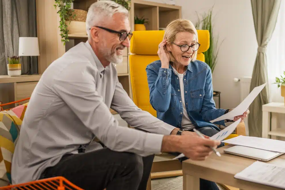 mature,senior,couple,husband,and,wife,work,together,form,home,