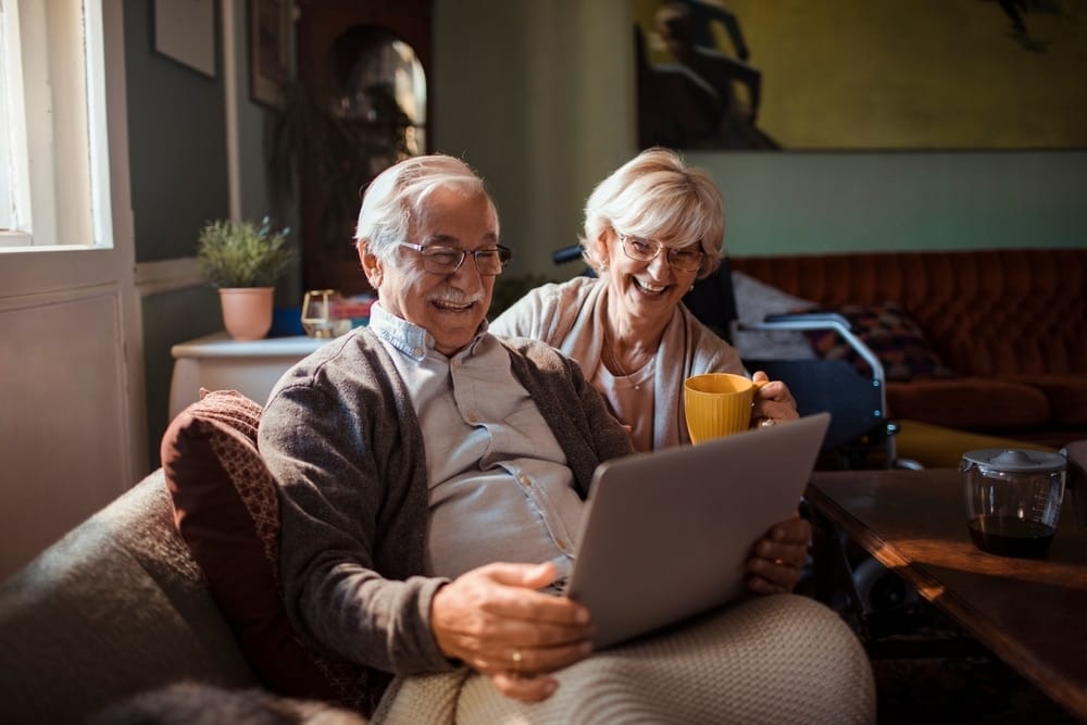 senior,couple,using,tablet,together,at,home