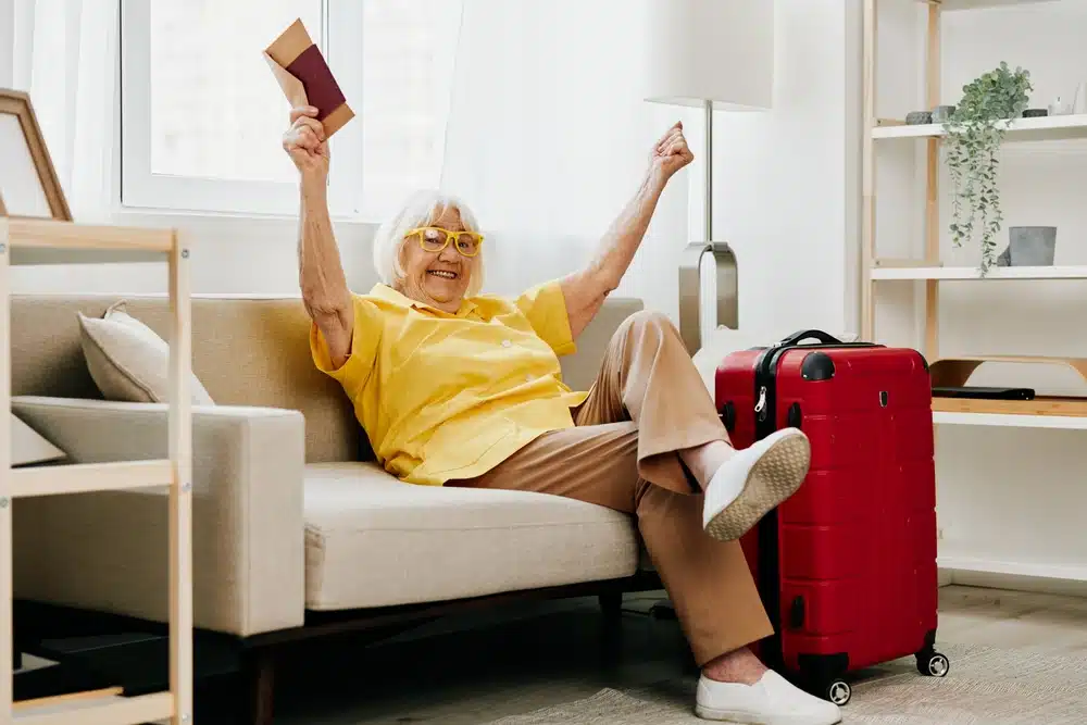 happy,senior,woman,with,passport,and,travel,ticket,packed,a