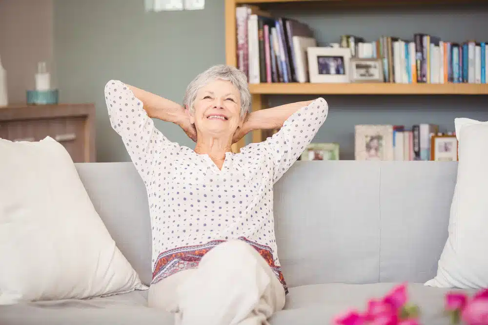 senior,woman,relaxing,on,sofa,at,home