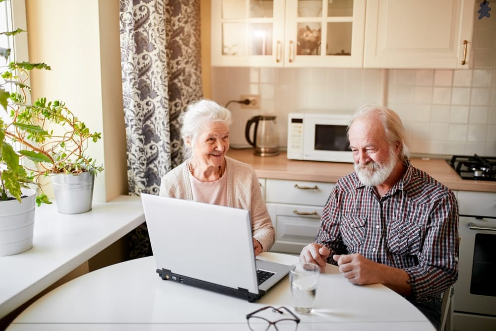 two,elderly,retired,people,spending,day,at,home,watching,vintage