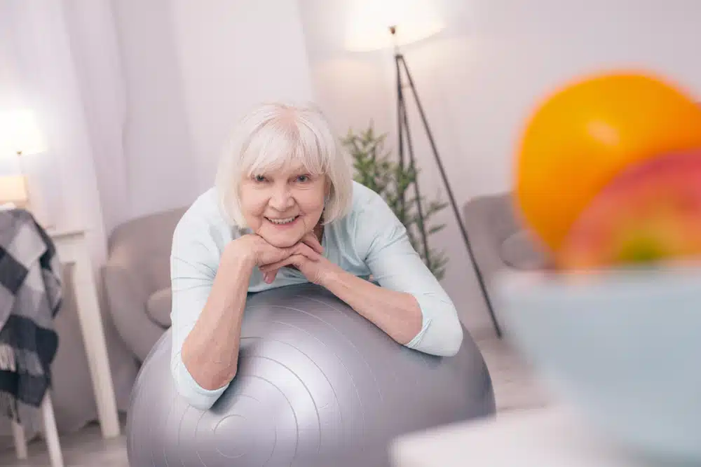 never fading,beauty.,pretty,senior,woman,lying,on,the,exercise,ball