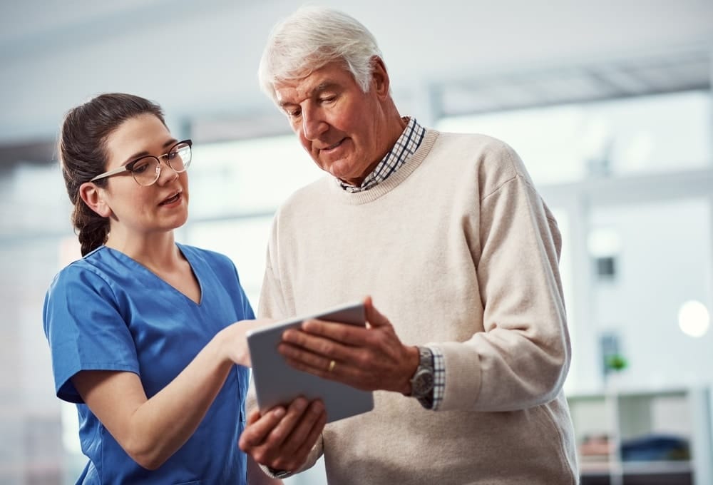 nurse,,tablet,and,healthcare,with,old,man,in,home,for