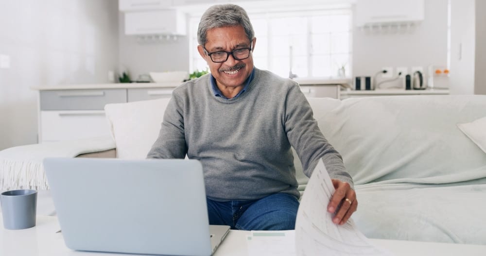 happy,,senior,man,and,financial,analysis,in,home,,documents,and
