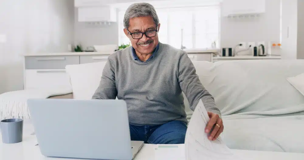 happy,,senior,man,and,financial,analysis,in,home,,documents,and