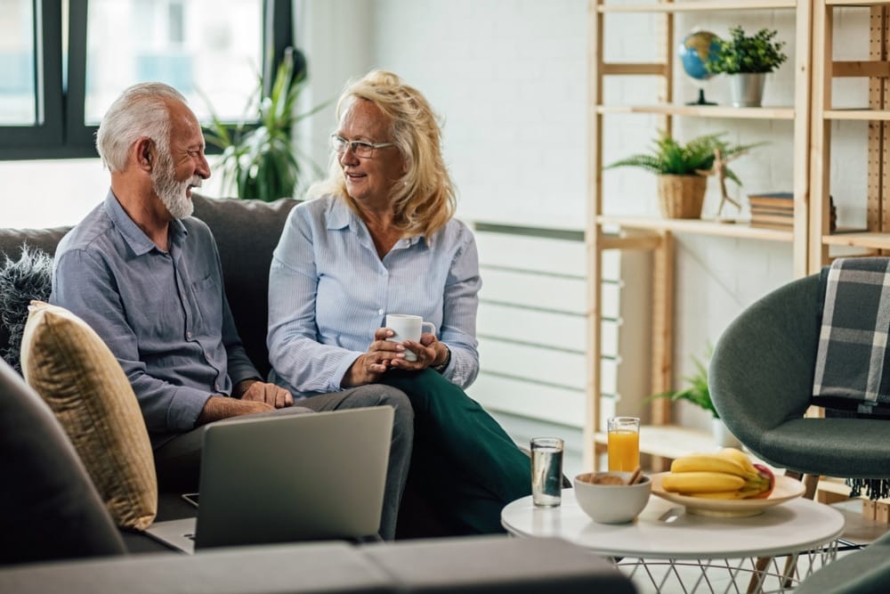 happy,mature,couple,communicating,while,enjoying,in,their,coffee,time