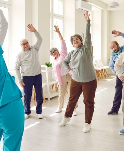 nurse,or,physiotherapist,doing,healthy,stretching,exercises,for,wellness,and